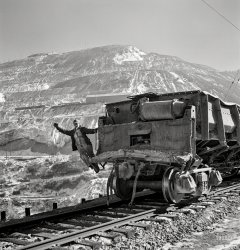 November 1942. "Utah Copper -- Bingham Mine. Brakeman of an ore train at the open-pit mining operations of Utah Copper Company at Bingham Canyon, Utah." Photo by Andreas Feininger for the Office of War Information. View full size.