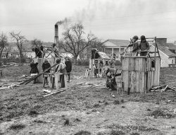 April 1935. "Schoolchildren building houses. Reedsville, West Virginia." After recess, Billy will scour the playground for any stray tools or fingers. Photo by Elmer S. Johnson for the Resettlement Administration. View full size.