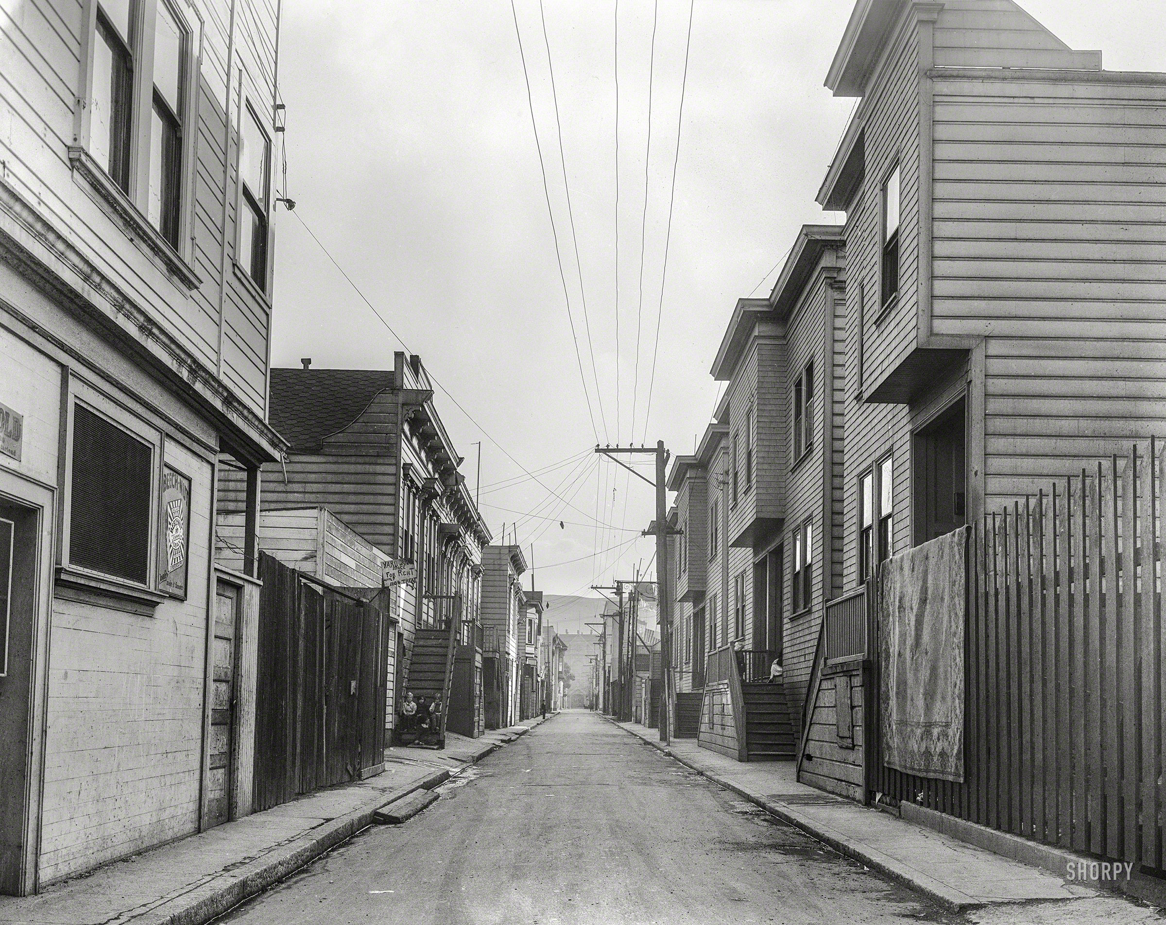 February 1936. "Lucky Street. Mission District, San Francisco. Rent twenty to twenty-two dollars a month for three or four rooms." Medium format acetate negative by Dorothea Lange for the Resettlement Administration. View full size.