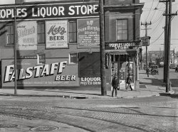 November 1938. "Saloon and liquor store near Cudahy packing plant. South Omaha, Nebraska." Metz on the left, Blatz on the right. Medium format negative by John Vachon for the Farm Security Administration. View full size.