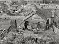 November 1938. "Houses along the railroad tracks. Omaha, Nebraska." Photo by John Vachon for the Resettlement Administration. View full size.