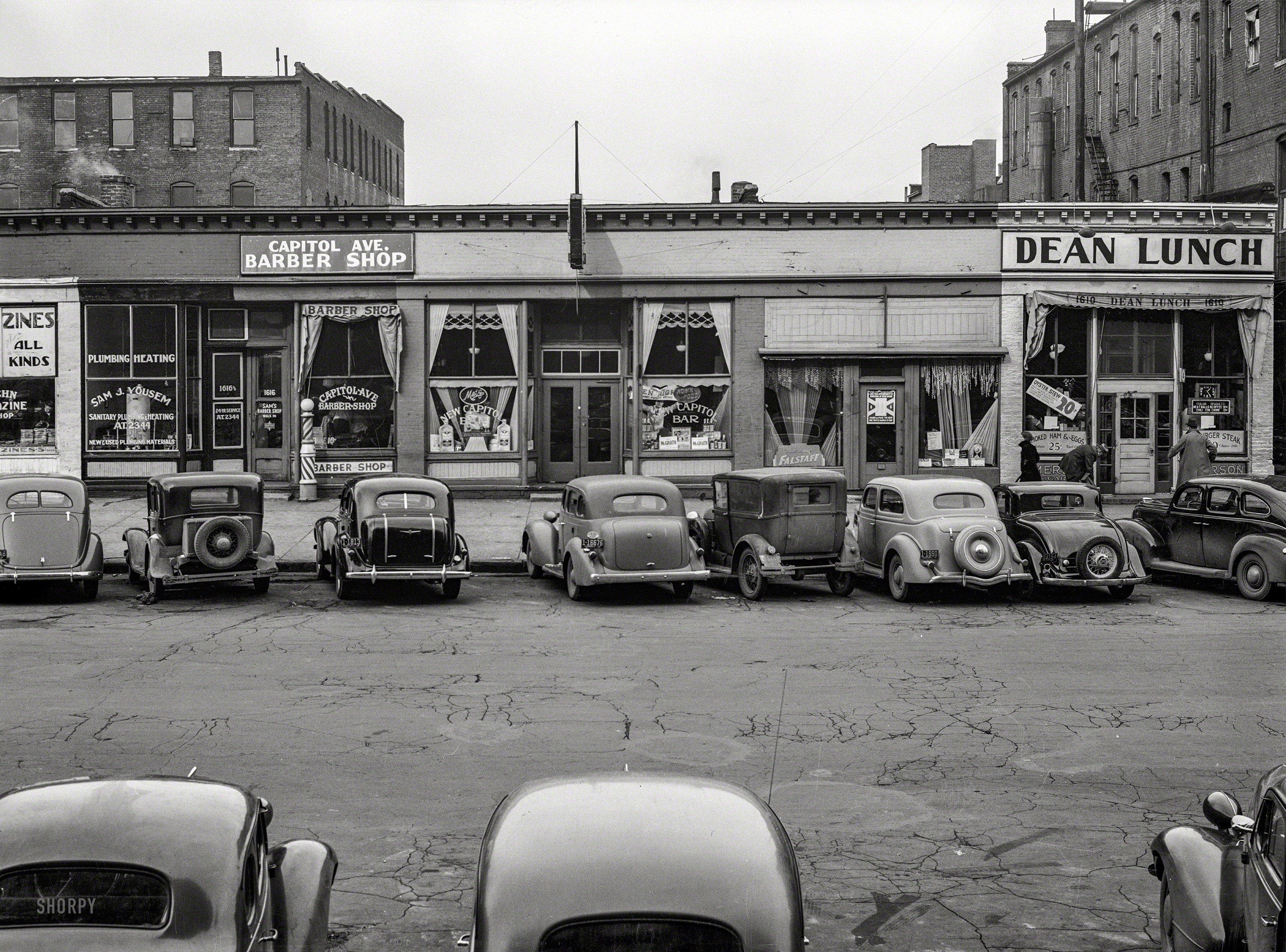 November 1938. "Capitol Avenue storefronts, Omaha, Nebraska." Medium format negative by John Vachon for the Resettlement Administration. View full size.