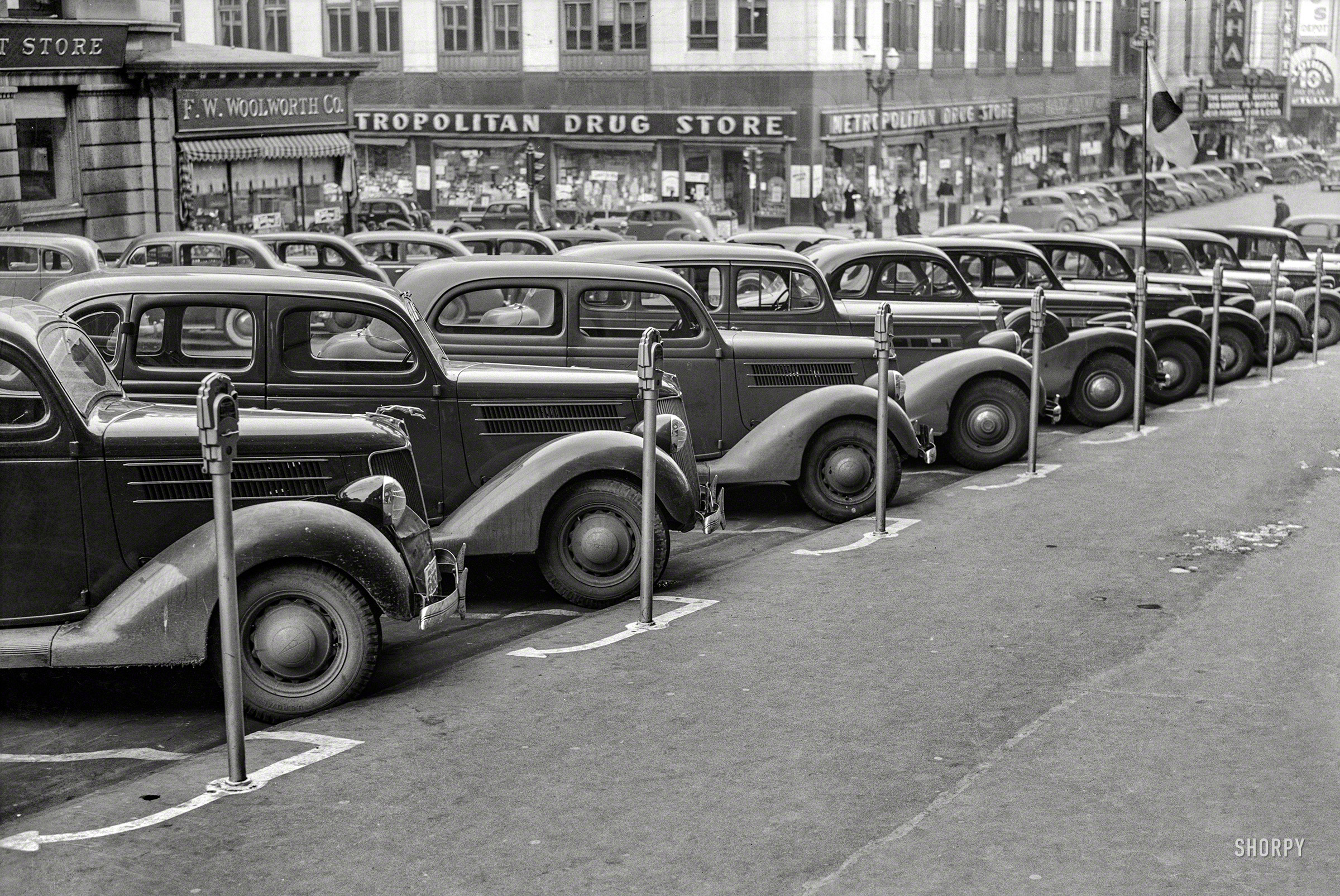 &nbsp; &nbsp; &nbsp; &nbsp; We've updated this post from 2008, originally illustrated with a low-res catalog print, with this high-resolution scan made from the original negative.
November 1938. Omaha, Nebraska. "Cars parked diagonally along a row of parking meters." Photo by John Vachon for the FSA. View full size. 