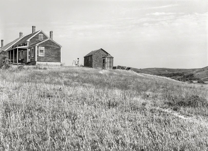 August 1940. "Tourist house in Truro, Massachusetts. The girl at the easel is a boarder. House belongs to incapacitated Portuguese fisherman and railroad worker from the Cape Verde Islands. He and his wife now make most of their income from boarding tourists in their lovely house during the short three-month season." Medium format negative by Edwin Rosskam. View full size.
