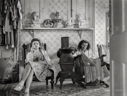 August 1940. Truro, Massachusetts. "Guests in bedroom of tourist house having a glass of whisky." Medium format negative by Edwin Rosskam. View full size.