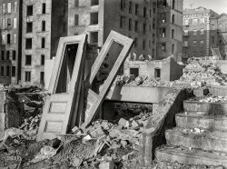 December 1941. "New York, New York. Demolition for slum clearance. Whole blocks of a slum area are torn down to make room for a housing project." Photo by Edwin Rosskam for the Office of War Information. View full size.