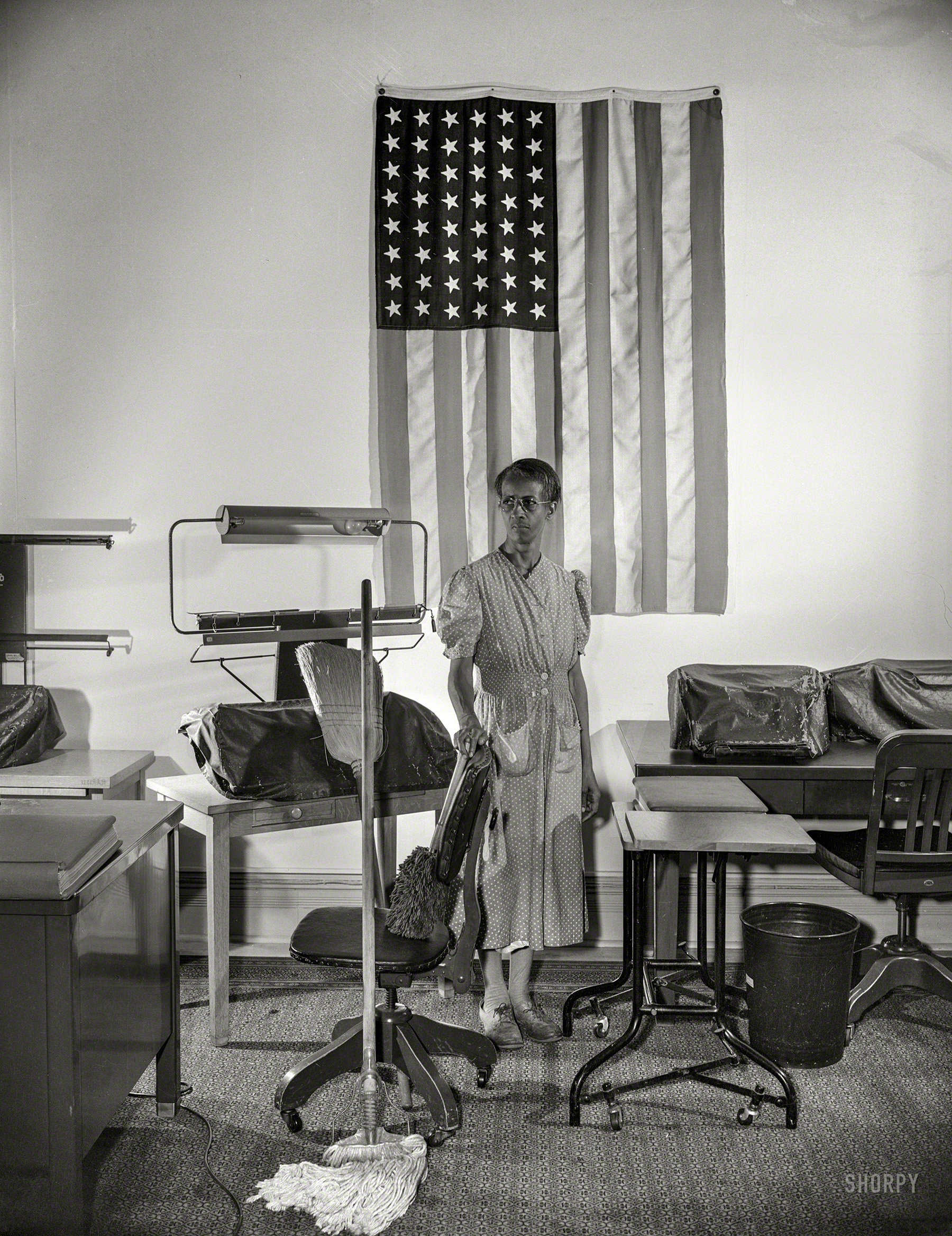 August 1942. "Ella Watson, government charwoman who provides for a family of six on her salary of $1,080 per year. She has been a federal employee for 26 years." Photo by Gordon Parks for the Office of War Information. View full size.