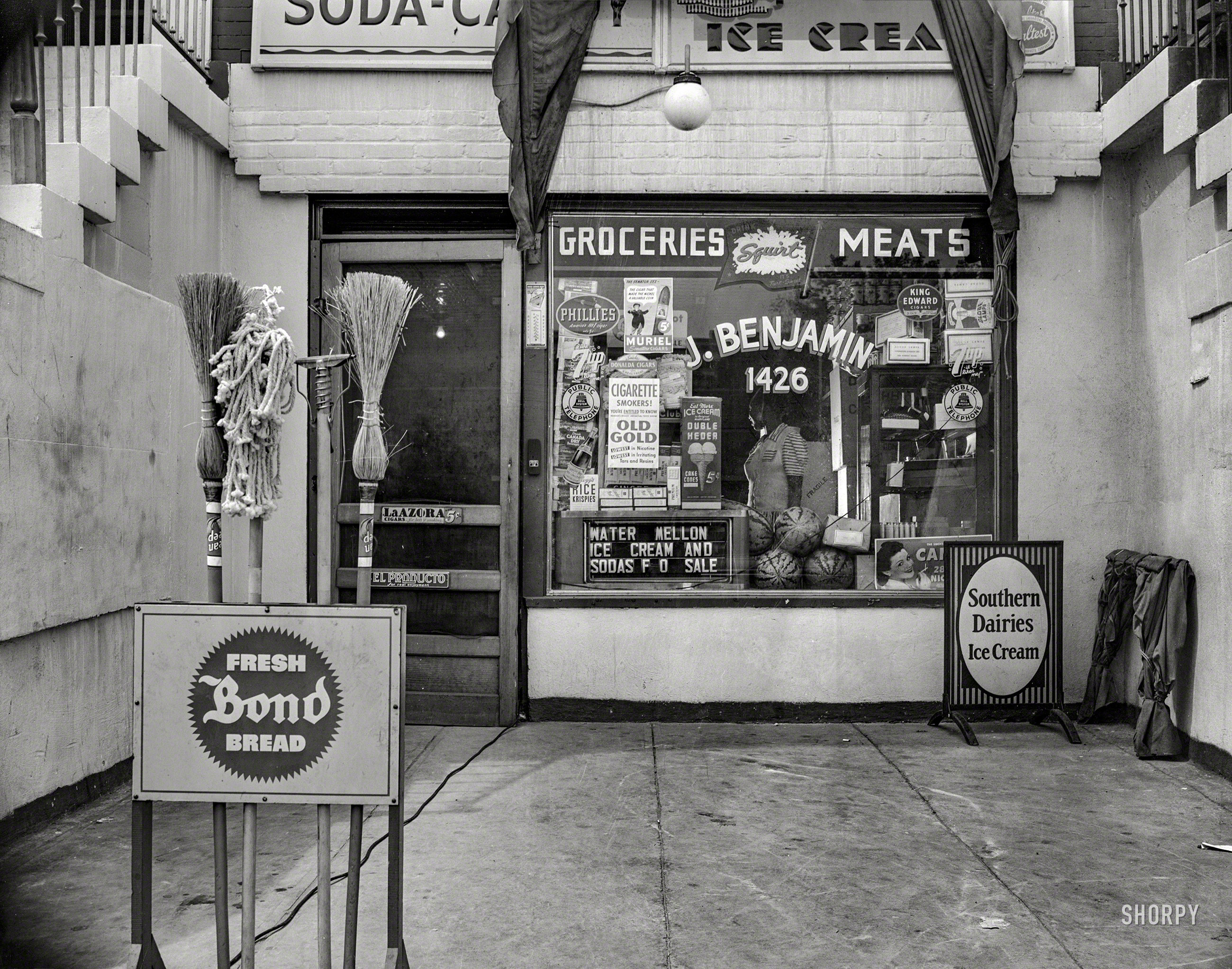 August 1942. Washington, D.C. "Grocery store at 1426 11th Street N.W., across the street from Mrs. Ella Watson, a government charwoman." 4x5 inch acetate negative by Gordon Parks for the Office of War Information. View full size.