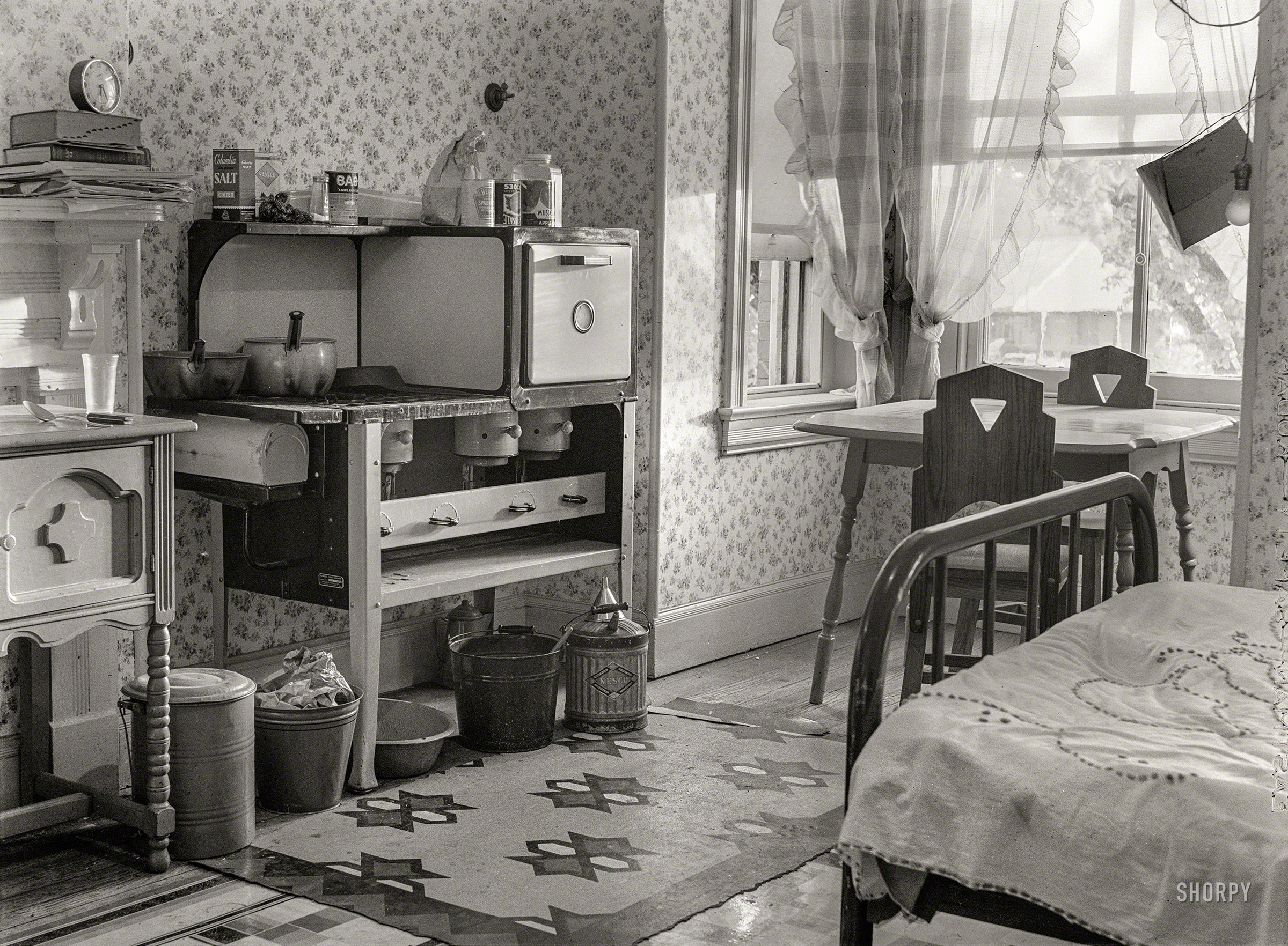 July 1939. "Washington, D.C. — Government worker's room." Equipped with a kerosene stove. Medium format negative by David Moffat Myers. View full size.