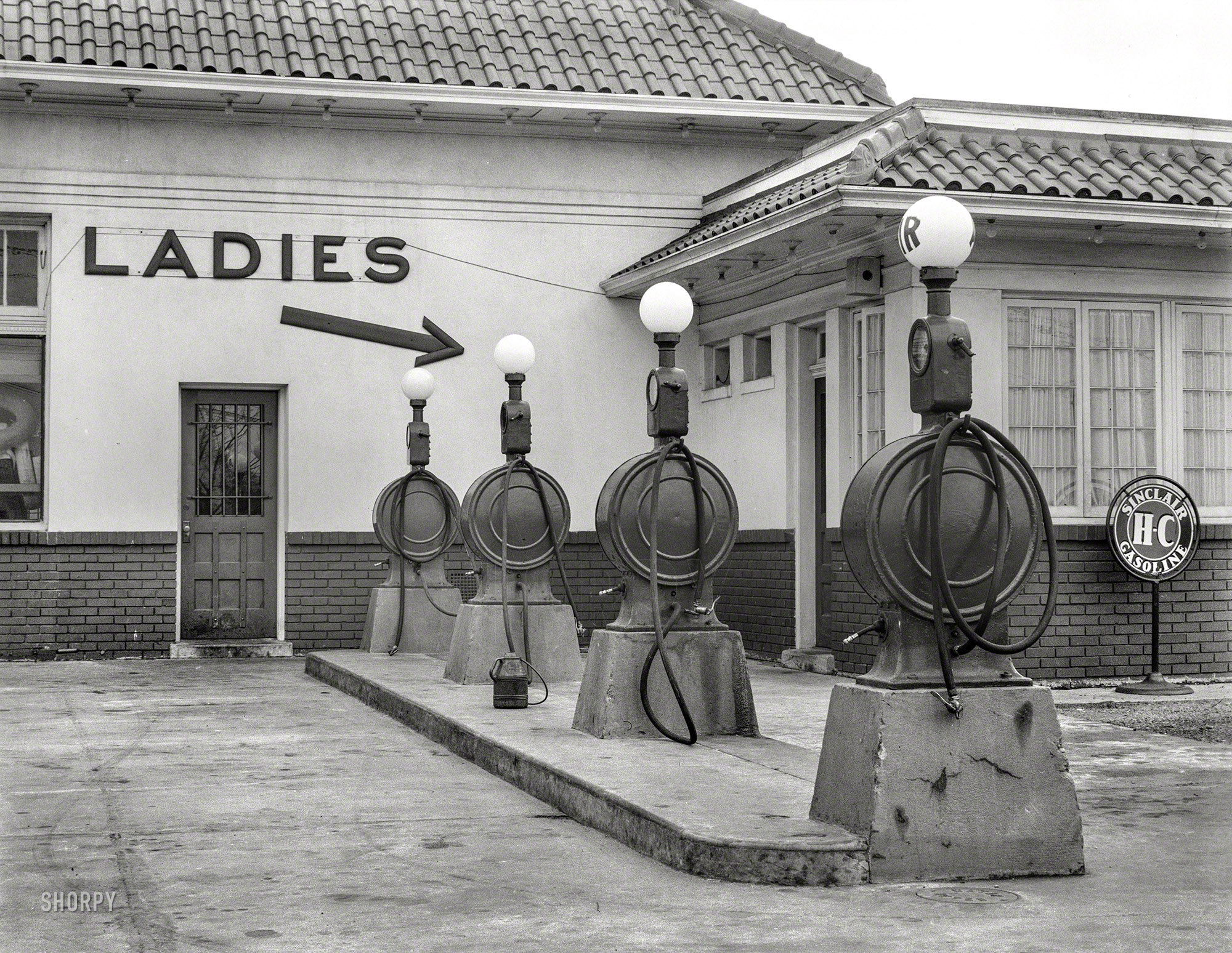 July 1939. "Gas station. Washington, D.C." Right this way to Ladies and Free Air. Medium format negative by David Moffat Myers. View full size.