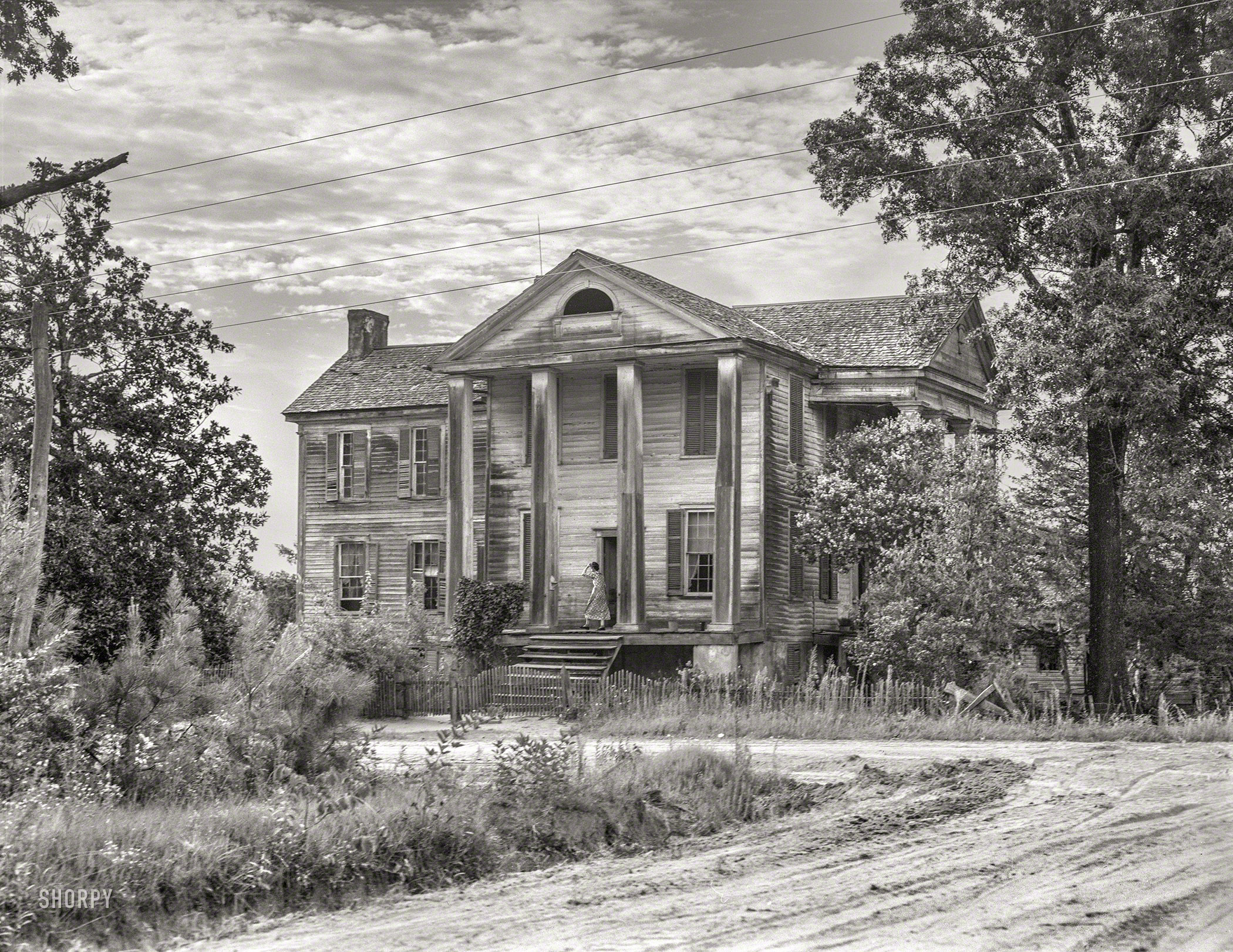 July 1937. "Antebellum plantation house in Greene County, Georgia." 4x5 acetate negative by Dorothea Lange, Farm Security Administration. View full size.