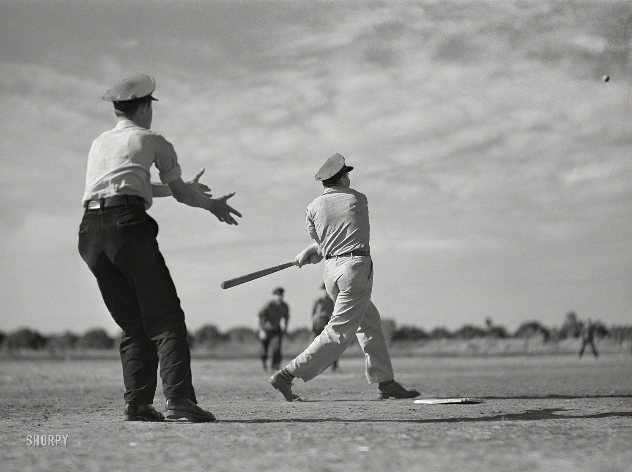 February 1942. "Weslaco, Texas. Saturday afternoon baseball game at Mercer G. Evans FSA camp." Photo by Arthur Rothstein for the Farm Security Administration. View full size.