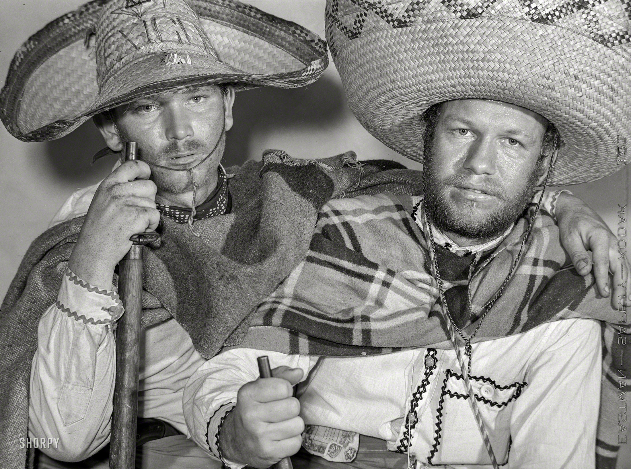 February 1942. "Brownsville, Texas. Charro Days fiesta. A pair of bandidos." Photo by Arthur Rothstein for the Office of War Information. View full size.