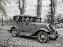 March 1940. "High school students in jalopy. Genoa, Nevada." Medium format negative by Arthur Rothstein, Farm Security Administration. View full size.
Jalopy? It might be a jalopy but it is only ten years old. A 1930 Ford Model A Deluxe sedan.
The Bard lives onShylock; "How now, Tubal? What news from Genoa? Hast thou found my daughter?"  Tubal; "yes, she has been joy riding with friends in a jalopy and spending all your money!" 
Center of townHere's the spot. The stone monuments just to the right of the hood are still there:

NOT Italian!People need to know that is is jen-OH-a, not GEN-oa,  emphasis on the oh.
Oldest town in Nevada, I believe. I have friends from there.
http://www.genoanevada.org/visitgenoa.htm
http://www.genoanevada.org/history.htm
Lovely little town.
Tires from Sears, and a brush with fameThe tires on the Ford are Allstates, sold by Sears.  Genoa was also the filming location for the bank robbery scene at the beginning of the 1973 Walter Matthau film "Charley Varrick", as the fictional Tres Cruces, New Mexico.  The exterior of the Genoa Courthouse Museum (just down the street from our merrymakers) played the "Tres Cruces Western Fidelity Bank of New Mexico".
And yes, Genoa is the oldest permanent settlement in Nevada.
(The Gallery, Cars, Trucks, Buses, John Vachon, Small Towns)