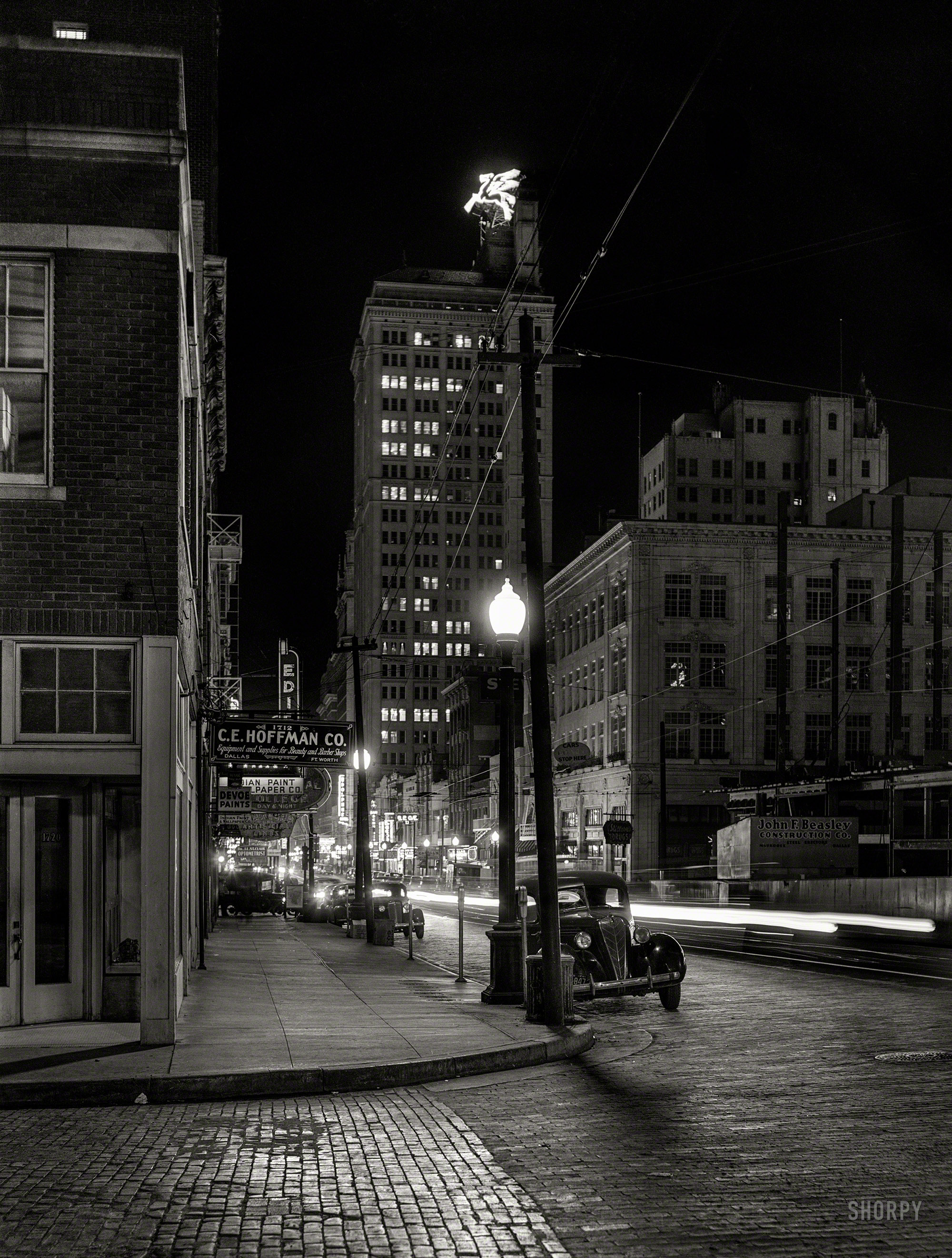 January 1942. "Night view, downtown section. Dallas, Texas." Medium format negative by Arthur Rothstein for the Office of War Information. View full size.