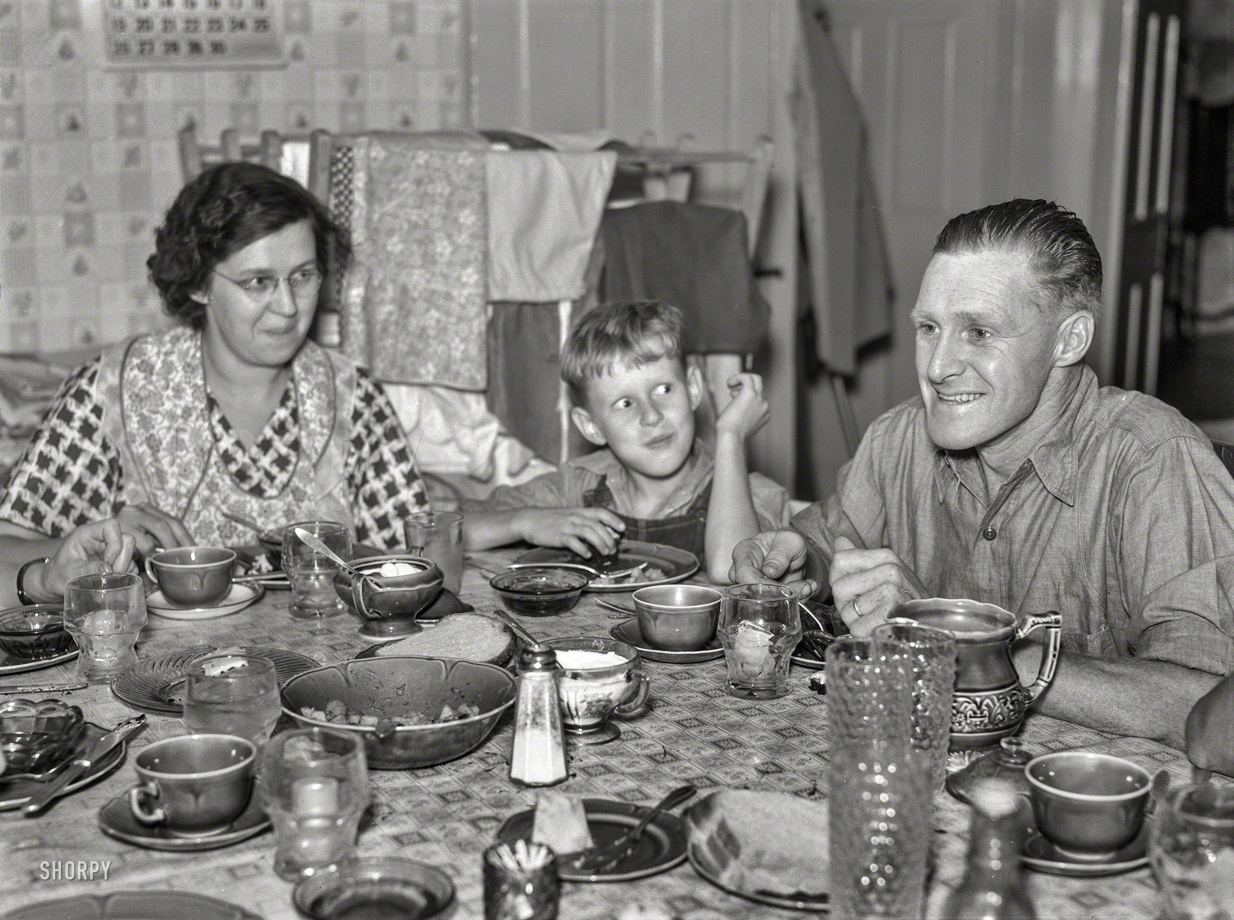 September 1937. "McNally family dairy farm in Kirby, Vermont. The McNallys at dinner." Photo by Arthur Rothstein for the Farm Security Admin. View full size.