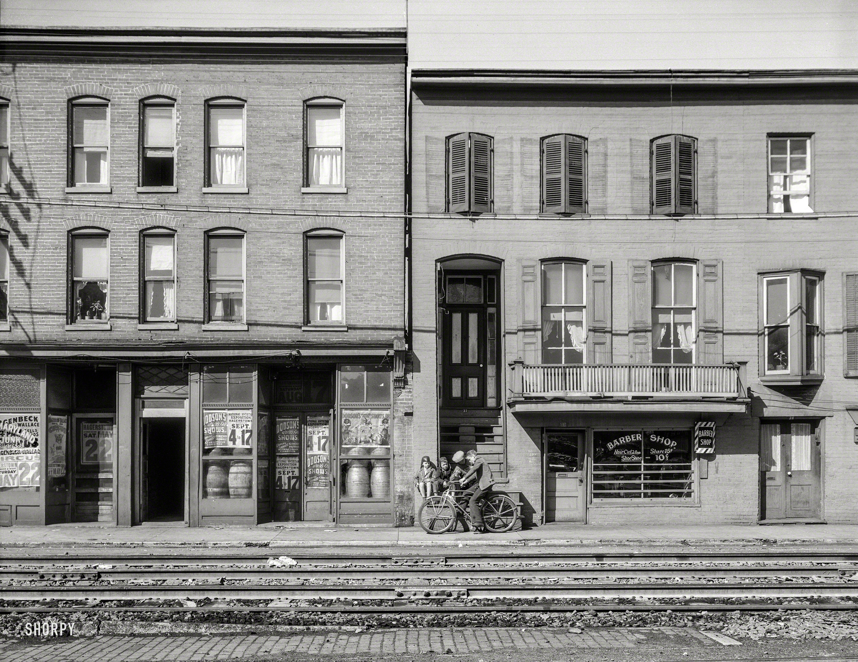 October 1937. "Houses near the railroad tracks. Hagerstown, Maryland." Our title comes from the storefront on the left. 4x5 inch acetate negative by Arthur Rothstein for the Farm Security Administration. View full size.