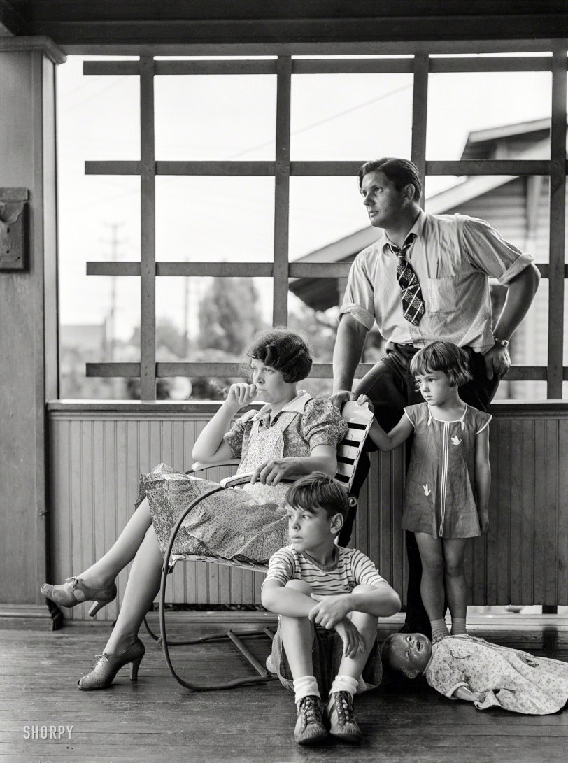 July 1938. "Family of Clifford Shorts, a roller at the Jones &amp; Laughlin mill. Photos show Aliquippa, Pennsylvania, a steel mill town on the Ohio River. Workers' homes on surrounding hills are segregated according to race or nationality in 'plans'." Medium format negative by Arthur Rothstein. View full size.

