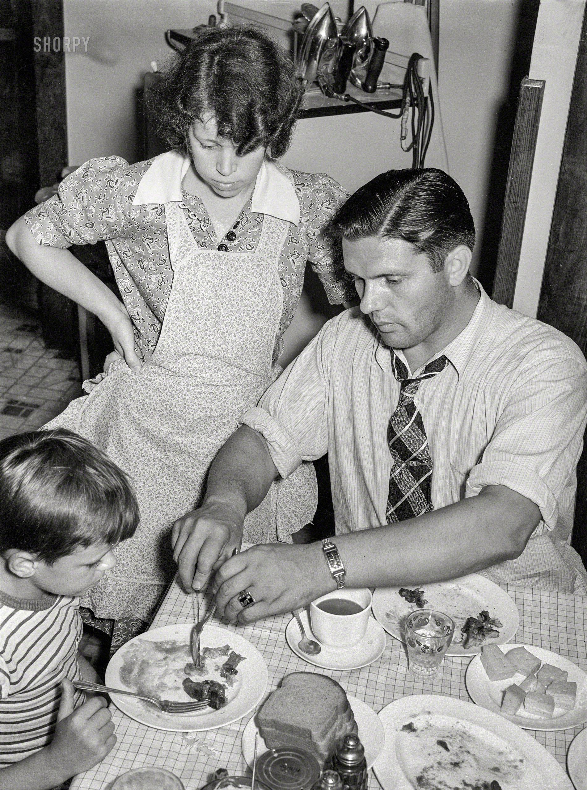 July 1938. Aliquippa, Pennsylvania. "The Clifford Shorts family at dinner. Mr. Shorts is a roller at the Jones & Laughlin steel mill." Medium format negative by Arthur Rothstein for the Farm Security Administration. View full size.