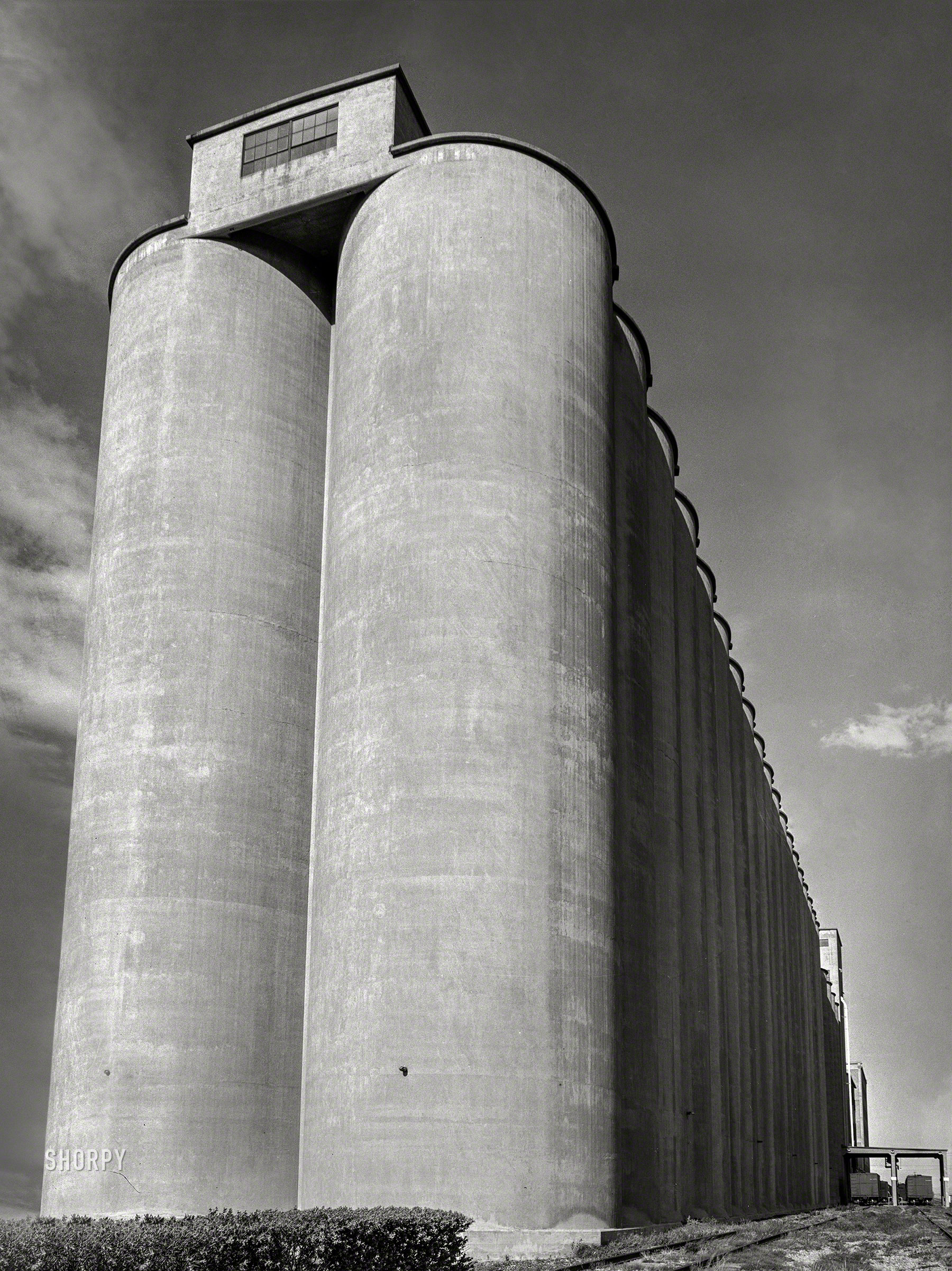 May 1939; "Grain elevators. Great Falls, Cascade County, Montana." Photo by Arthur Rothstein for the Farm Security Administration. View full size.