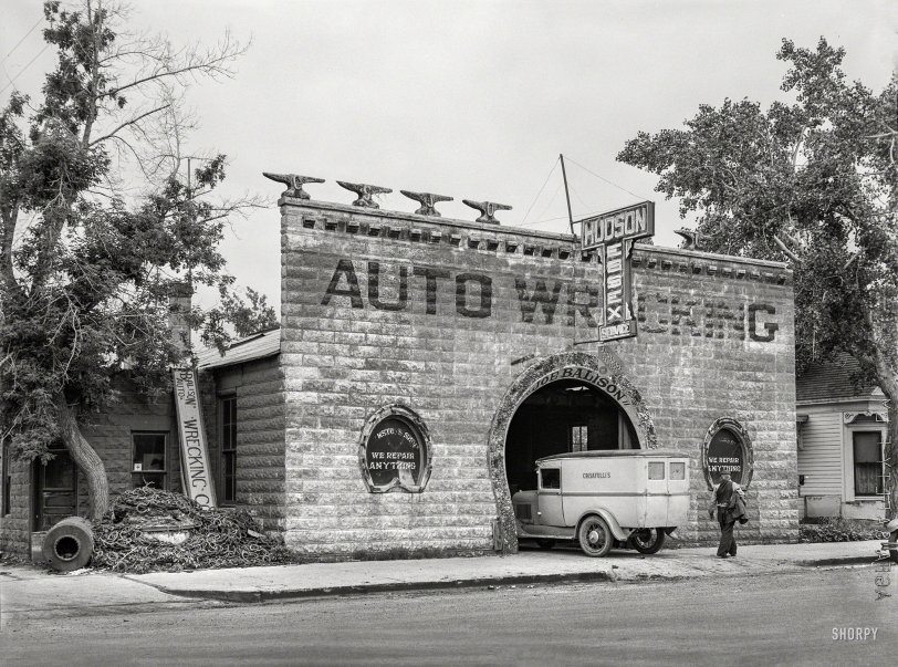 June 1939. "Blacksmith shop now used for auto repair. Glendive, Montana." A strong horseshoe motif here, architecturally speaking, in addition to the giant pile of actual horseshoes. Roofline of alphabetical anvils by Wile E. Coyote. "Wrecking" by "Joe Balison," who seems to be a fan of quote marks. Medium format negative by "Arthur Rothstein" for the "Farm Security Administration." View full size.
