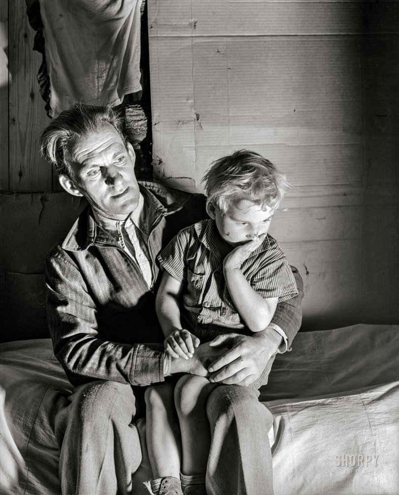 November 1939. Butler County, Missouri. "Evicted sharecropper and son. Camp of makeshift homes built by white and Negro sharecroppers evicted from plantation." Medium format acetate negative by Arthur Rothstein for the Farm Security Administration. View full size.
