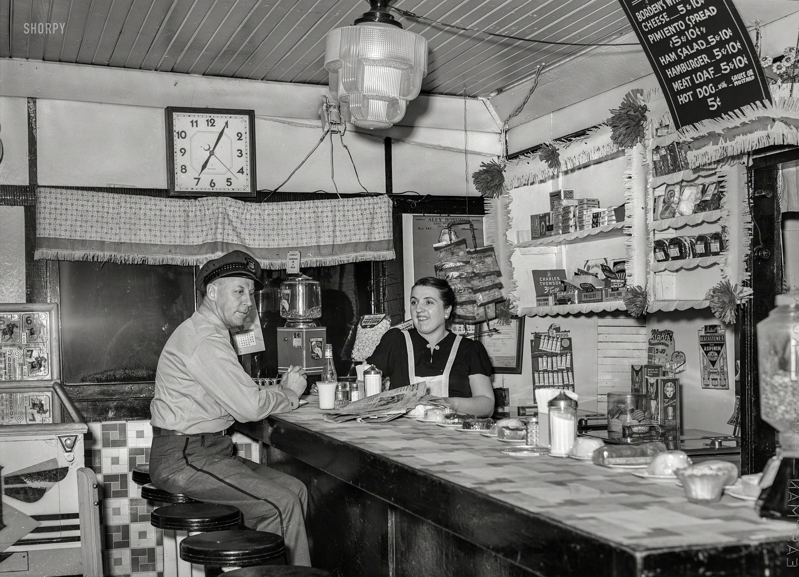 February 1940. "Truck driver in diner. Clinton, Indiana." Medium format negative by Arthur Rothstein for the Farm Security Administration. View full size.