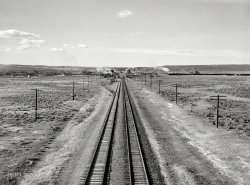 March 1940. "Southern Pacific track approaching Wells, Elko County, Nevada." Photo by Arthur Rothstein for the Farm Security Administration. View full size.