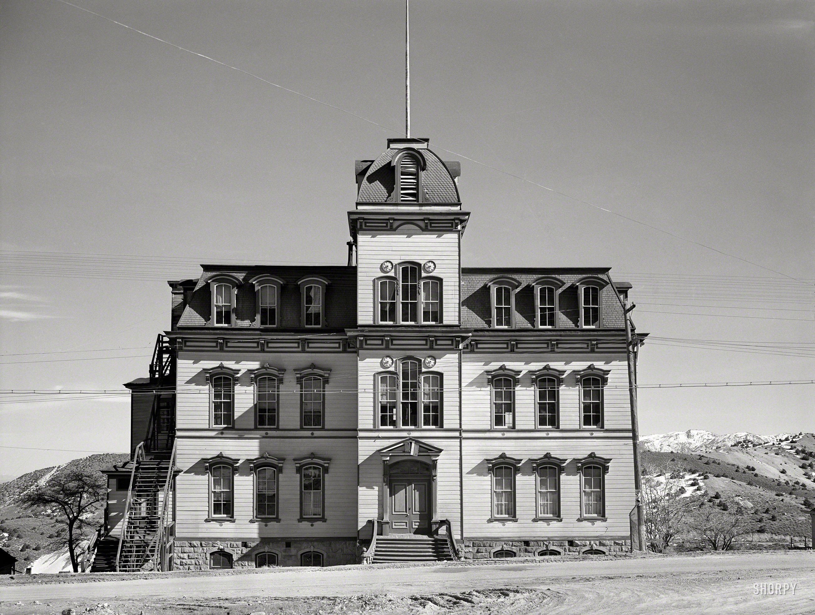 &nbsp; &nbsp; &nbsp; &nbsp; The last remaining Second Empire schoolhouse in the United States, the Fourth Ward School is now a museum.
March 1940. "Abandoned school. Virginia City, Nevada." Medium format negative by Arthur Rothstein for the Farm Security Administration. View full size.