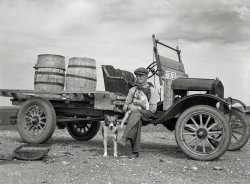September 1937. "Herman Gerling, farmer. Barrels on truck are for hauling spring water. Near Wheelock, North Dakota." Medium format negative by Russell Lee for the Farm Security Administration. View full size.