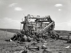 September 1937. "Old threshing machine on Herman Gerling's farm near Wheelock, North Dakota. There have been no crops for eight years." Photo by Russell Lee for the Farm Security Administration. View full size.