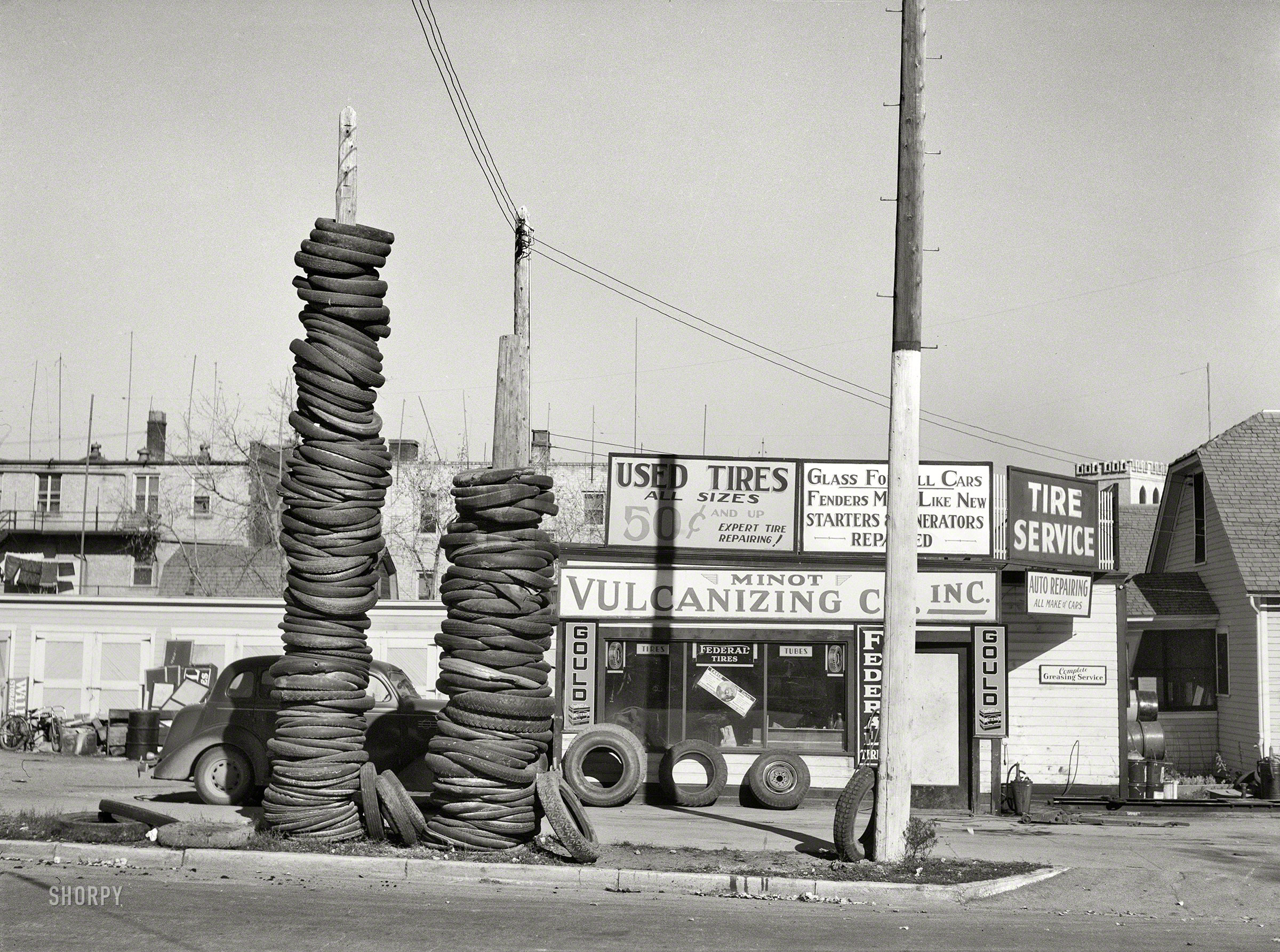 October 1937. "Used tires -- Minot, North Dakota." Medium format acetate negative by Russell Lee for the Farm Security Administration. View full size.
