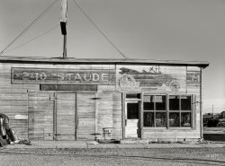 November 1937. "Old building in Plentywood, Montana." Former home of the "$240 Staude." Medium format negative by Russell Lee for the Farm Security Administration. View full size.