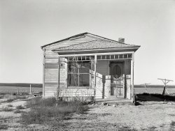 November 1937. "Abandoned house near Ambrose, Divide County, North Dakota." Photo by Russell Lee for the Farm Security Administration. View full size.