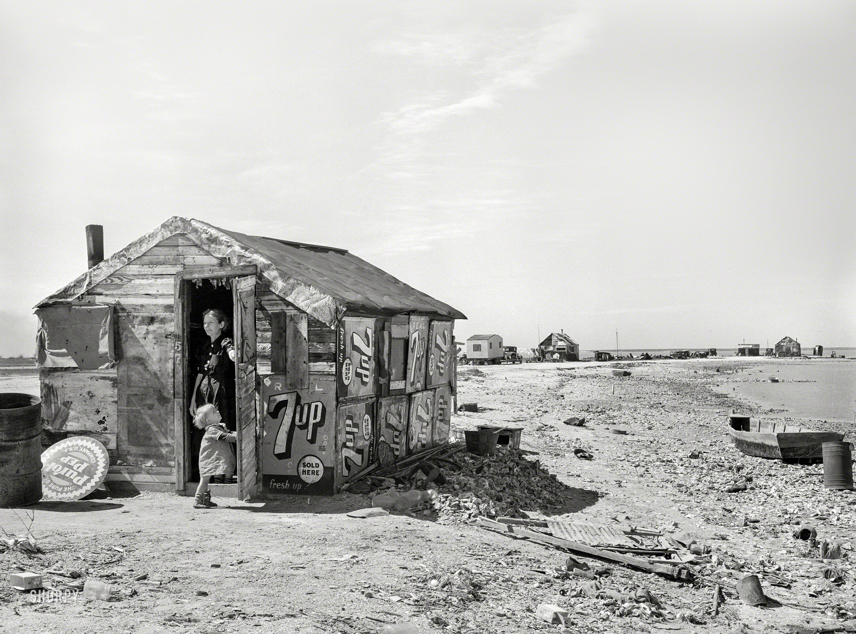 February 1939. "Shack of war veteran with view along Nueces Bay. Corpus Christi, Texas." Medium format acetate negative by Russell Lee. View full size.