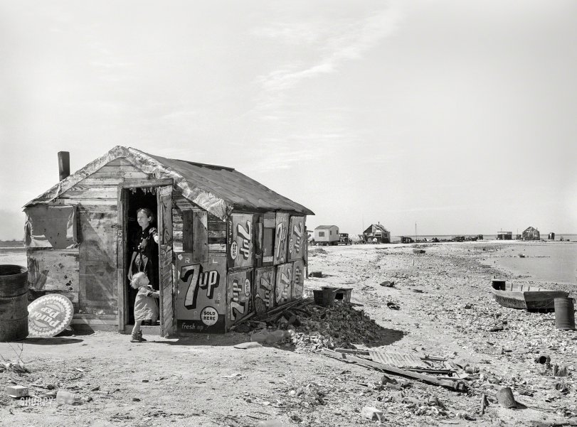 February 1939. "Shack of war veteran with view along Nueces Bay. Corpus Christi, Texas." Medium format acetate negative by Russell Lee. View full size.
