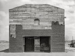 March 1939. "Abandoned theater decorated with bottle caps. Quemado, Texas." Medium format acetate negative by Russell Lee for the Resettlement Administration. View full size.
