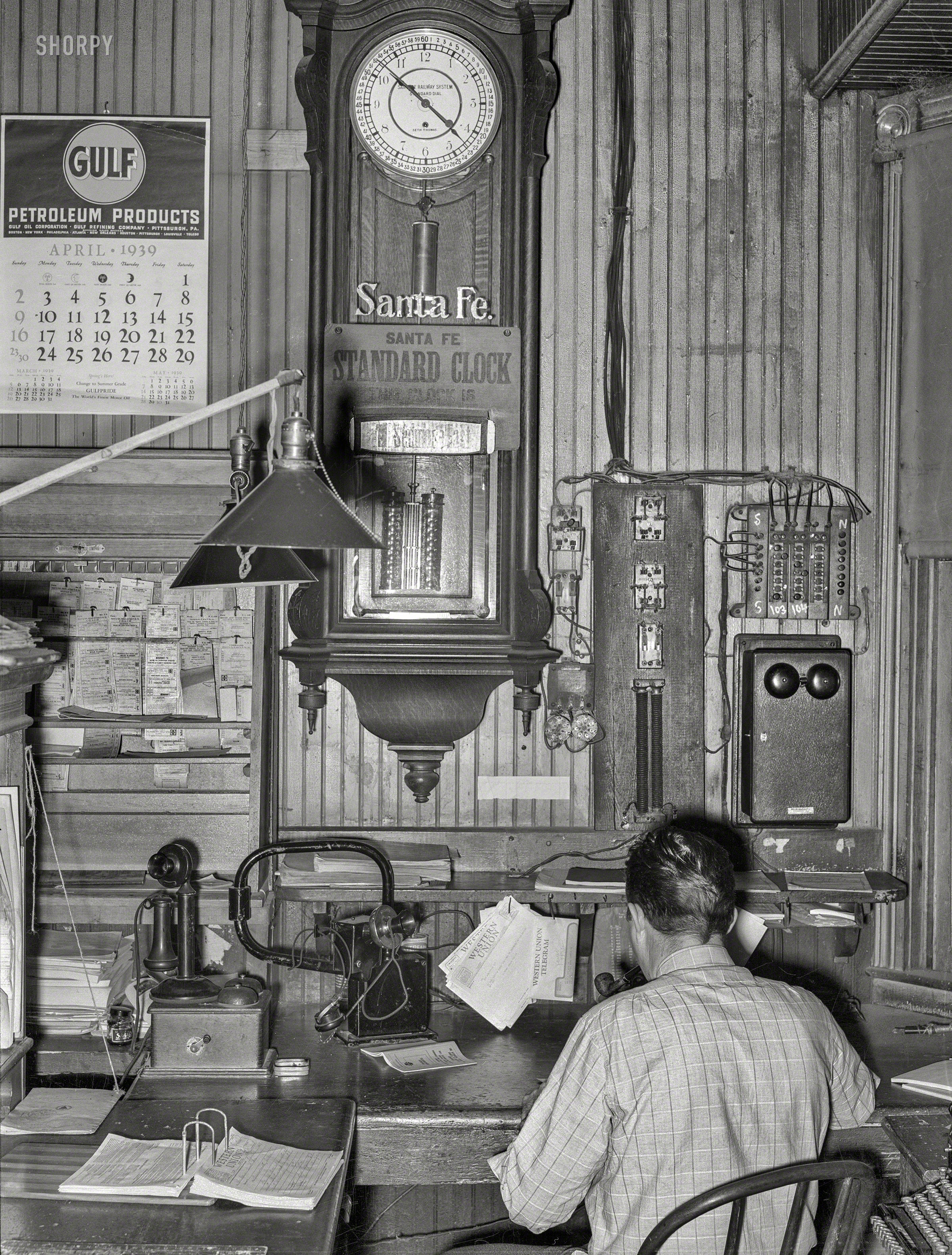 April 1939. "Office of train dispatcher and Western Union. San Augustine, Texas." Photo by Russell Lee for the Farm Security Administration. View full size.