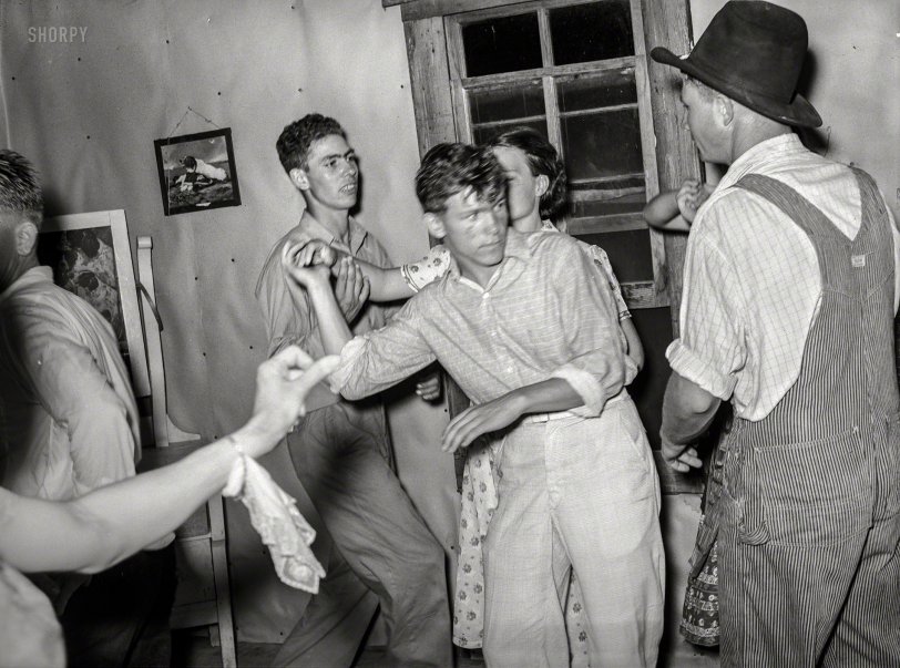 July 1939. "Detail of square dance in hills near McAlester, Pittsburg County, Oklahoma. Sharecropper's home." Medium format acetate negative by Russell Lee for the Farm Security Administration. View full size.