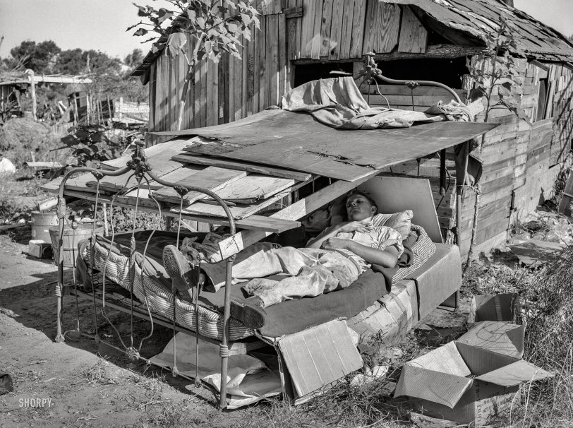 July 1939. "Bed with roof over it in May Avenue camp, Oklahoma City." Photo by Russell Lee for the Farm Security Administration. View full size.
