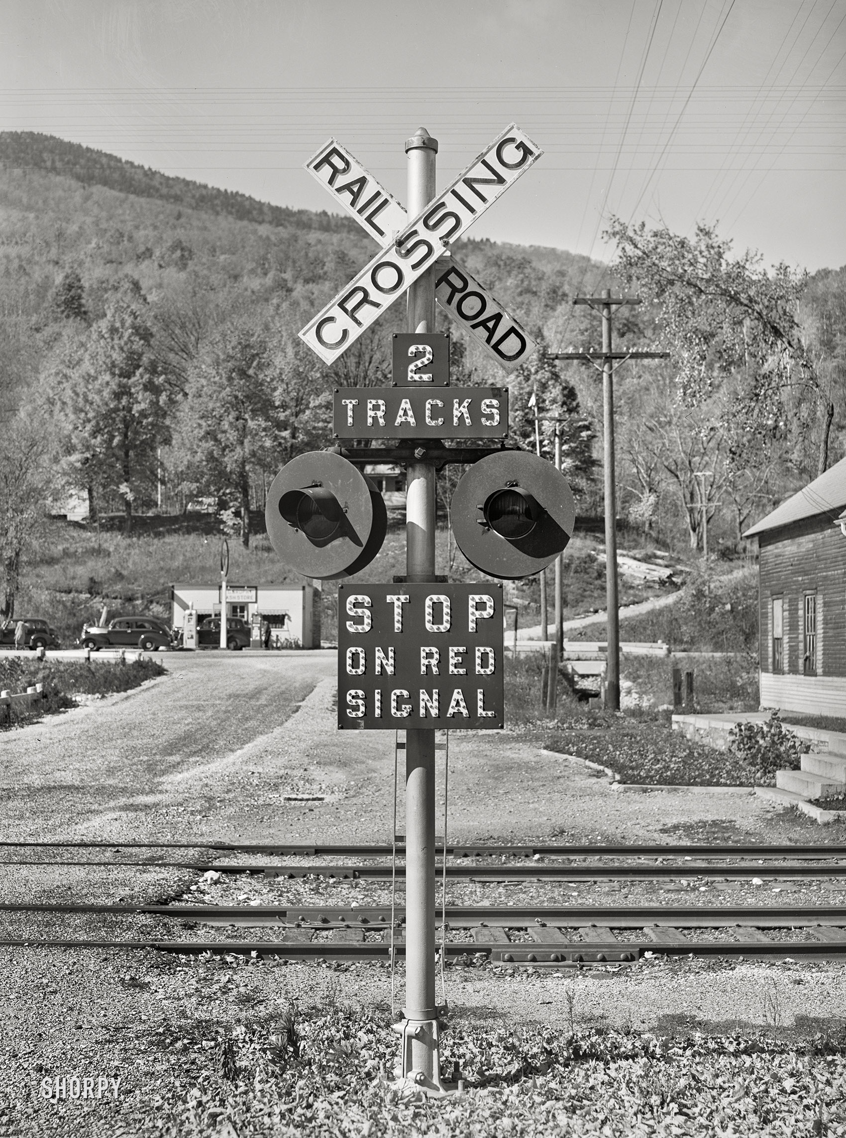 October 1939. "Railroad crossing near Shaftsbury, Vermont." Medium format negative by Russell Lee for the Farm Security Administration. View full size.