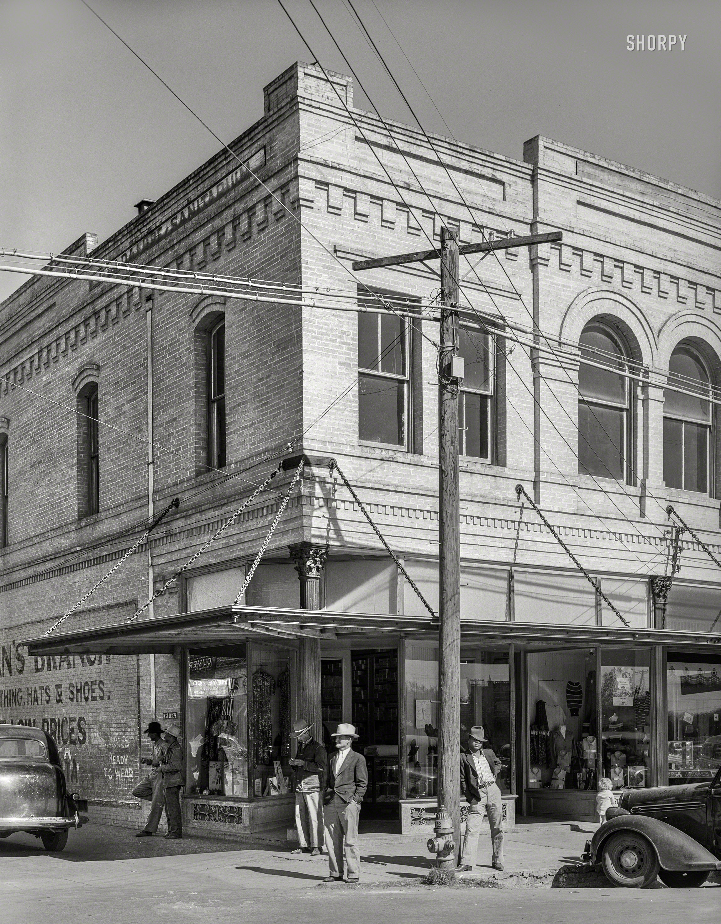 November 1939. "Street corner in Gonzales, Texas." Medium format acetate negative by Russell Lee for the Farm Security Administration. View full size.