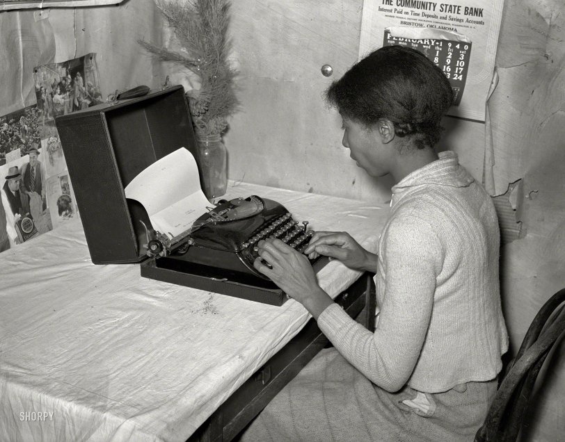 February 1940. Creek County, Oklahoma. "Wife of Pomp Hall, Negro tenant farmer, writing on typewriter. Through union activities this family has developed a desire for higher education. This typewriter is to them a symbol of that education and as such is the most prized family possession." Medium format negative by Russell Lee for the Farm Security Administration. View full size.
