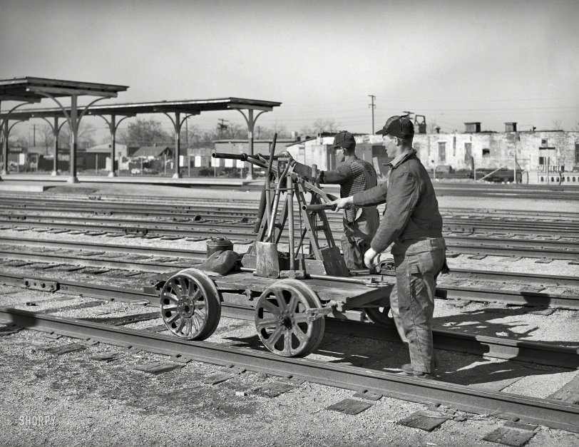 February 1940. "Railway workmen with handcar. Oklahoma City, Oklahoma." Photo by Russell Lee for the Farm Security Administration. View full size.
