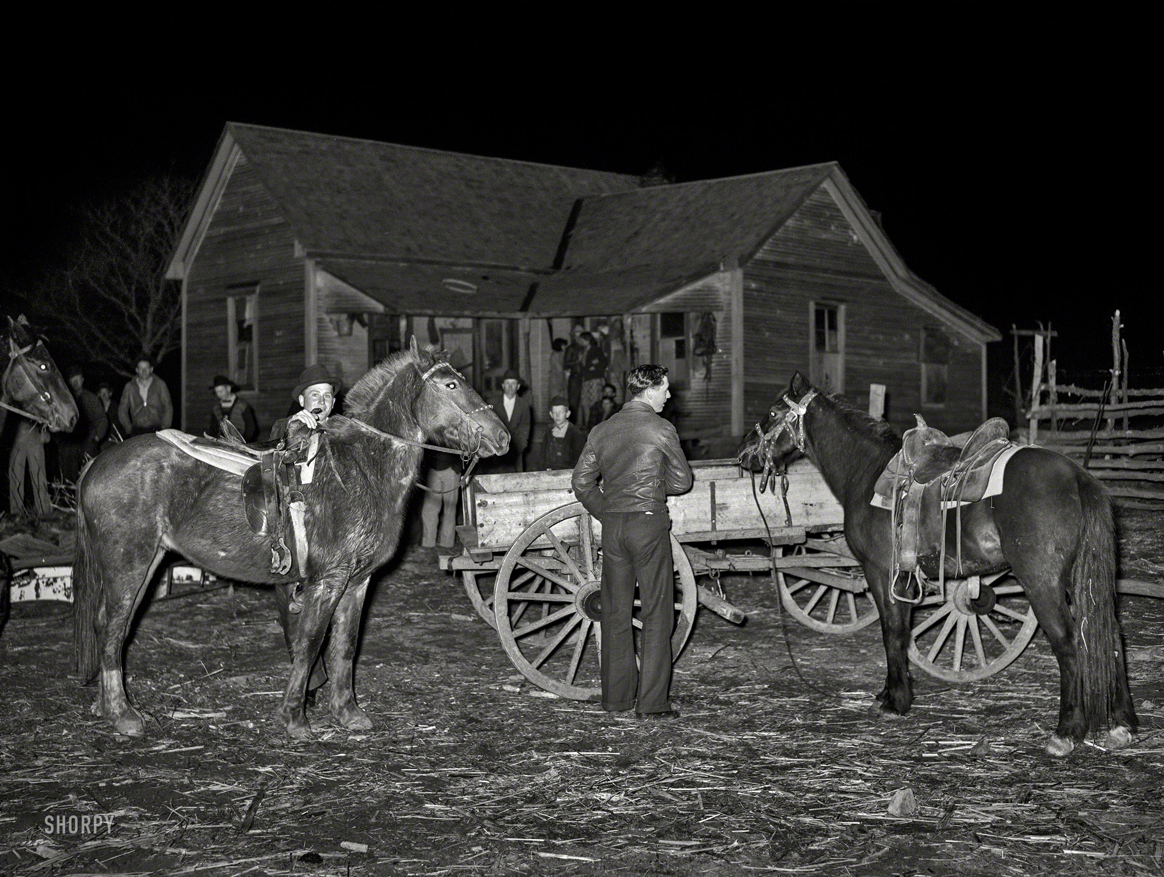 February 1940. "Farm boys tying up their horses at a 'play party' in McIntosh County, Oklahoma." Nice ride, Joe, but have you seen Billy's new mustang? Photo by Russell Lee for the Farm Security Administration. View full size.
