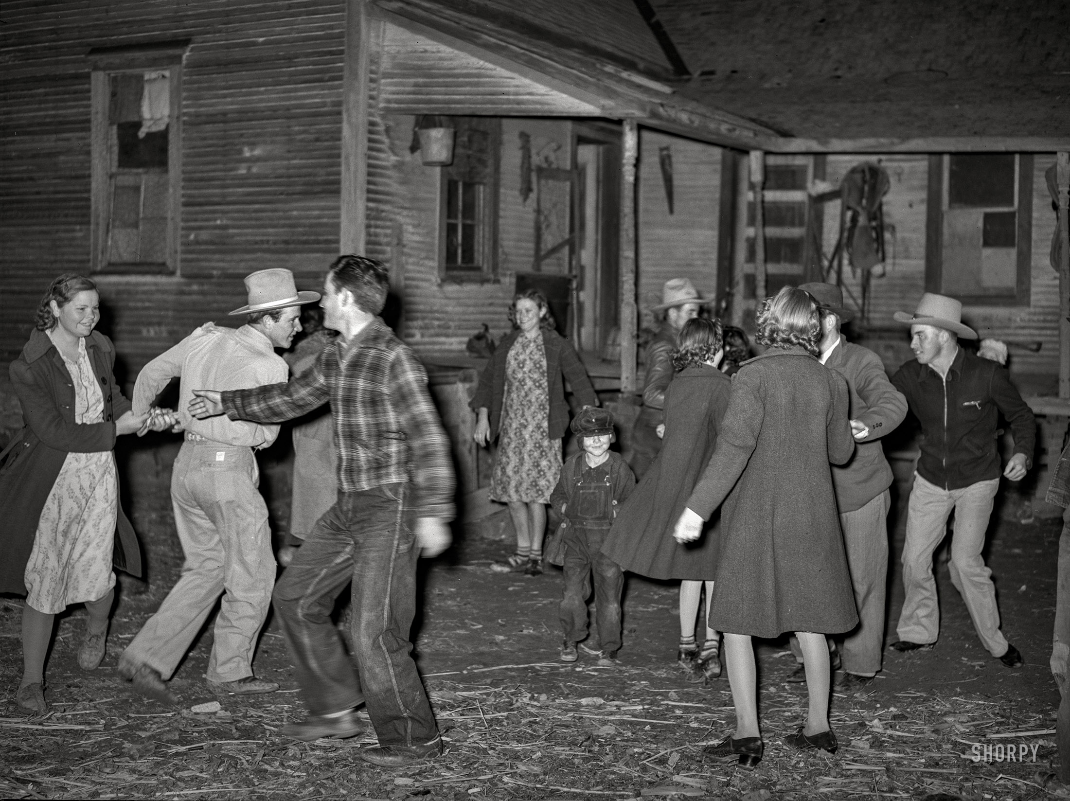 February 1940. "Swing game at 'play party' in McIntosh County, Oklahoma." Photo by Russell Lee for the Farm Security Administration. View full size.
