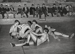 February 1940. "Basketball players resting between periods. Eufaula, Oklahoma." Photo by Russell Lee for the Farm Security Administration. View full size.