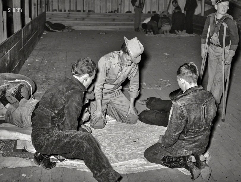 March 1940. San Angelo, Texas. "Boys in a crap game at the San Angelo Fat Stock Show." Photo by Russell Lee for the Farm Security Admin. View full size.
