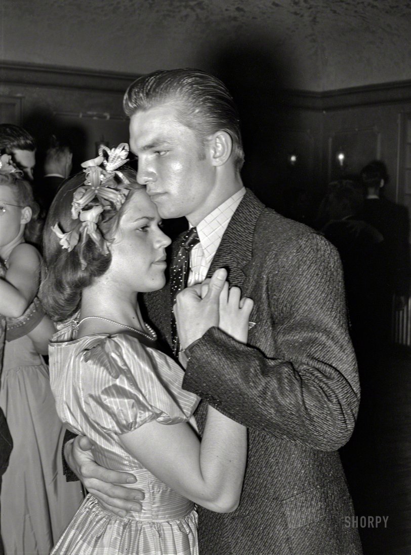 March 1940. "Young Texas couple at the Junior Chamber of Commerce dance during the San Angelo Fat Stock Show." Medium format acetate negative by Russell Lee for the Farm Security Administration. View full size.
