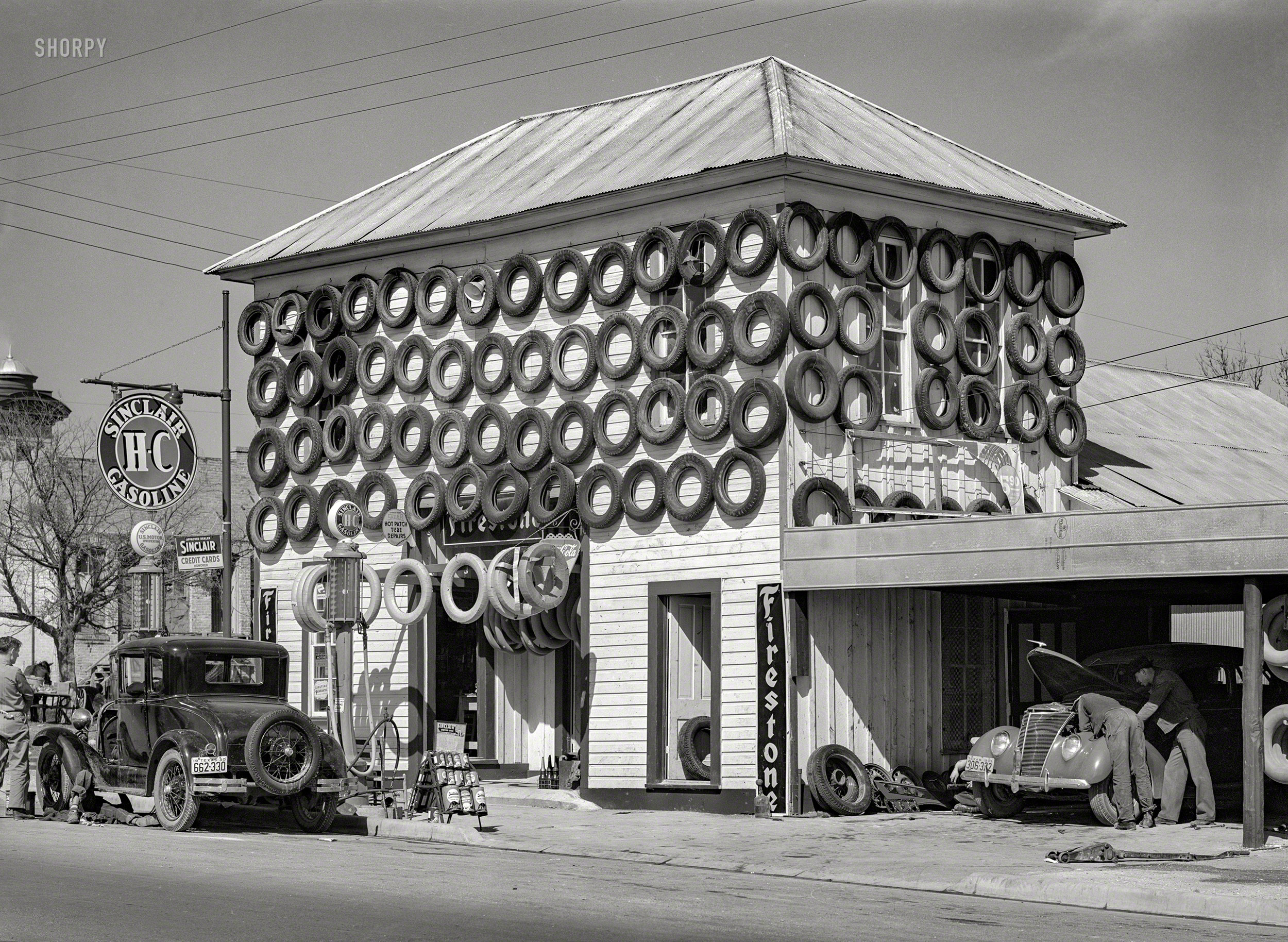 March 1940. "Secondhand tires displayed for sale at service station in San Marcos, Texas." A leading candidate for the first Krispy Kreme franchise. Medium format negative by Russell Lee for the Farm Security Administration. View full size.